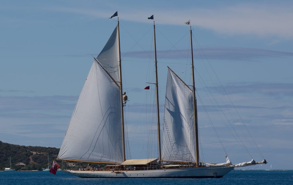 Raising the sails on a Classic Yacht Charter